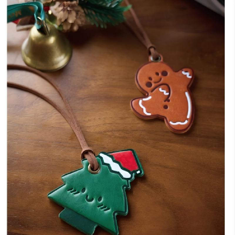 Leather Christmas ornaments flatlay gingerbread and tree