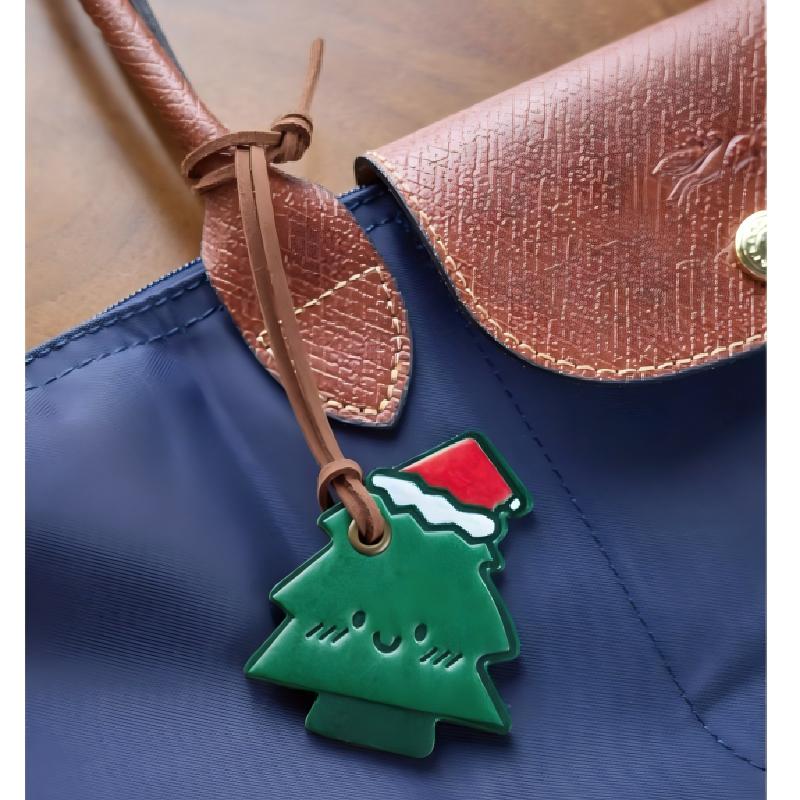Christmas tree leather charm hanging on handbag