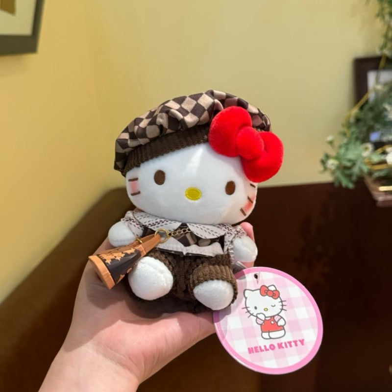 Hello Kitty plush bag charm in brown checkered hat and outfit
